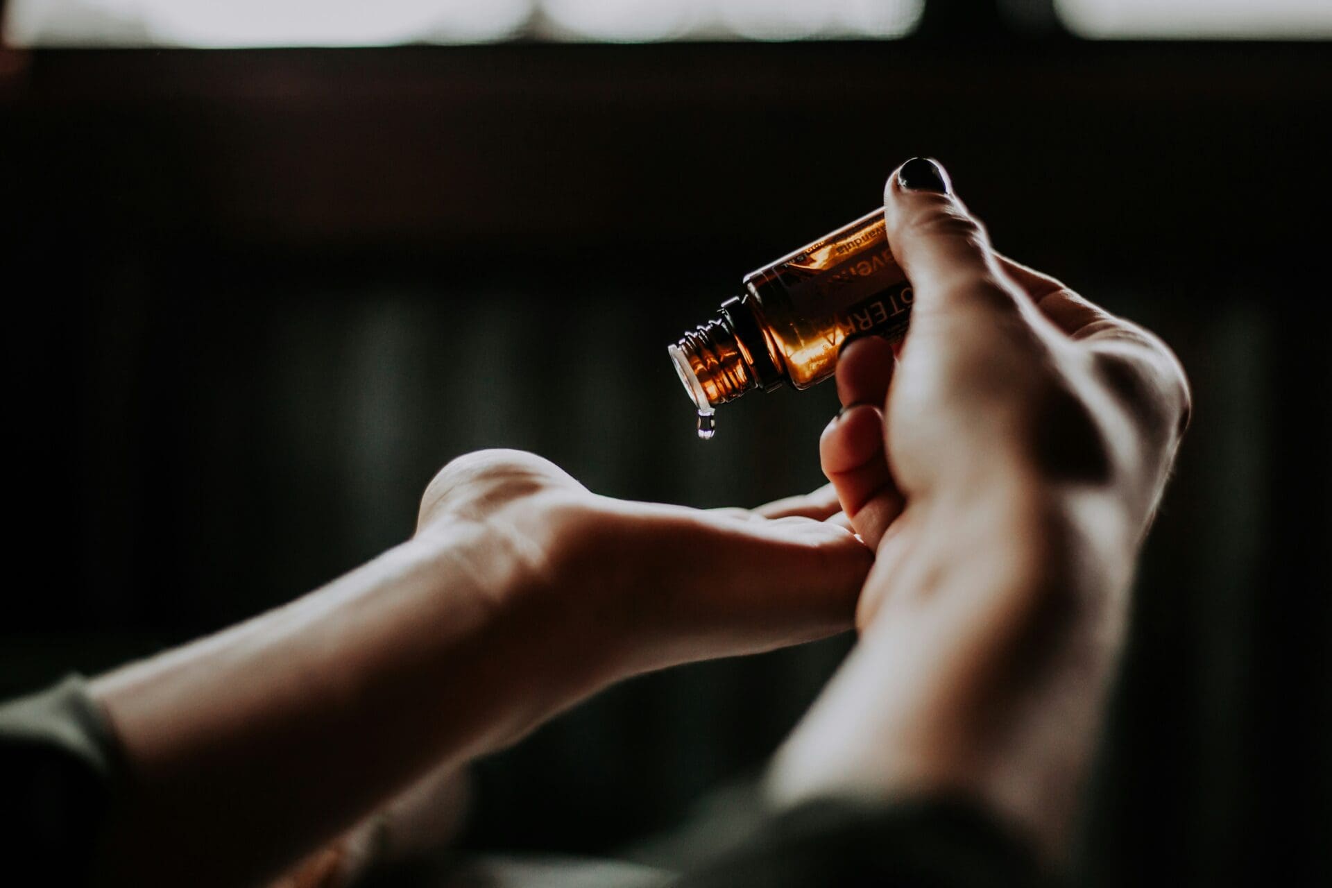 A person about to use oil in their level 4 sports massage course.