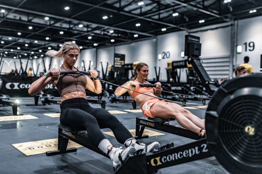 hyrox training two women on the rower