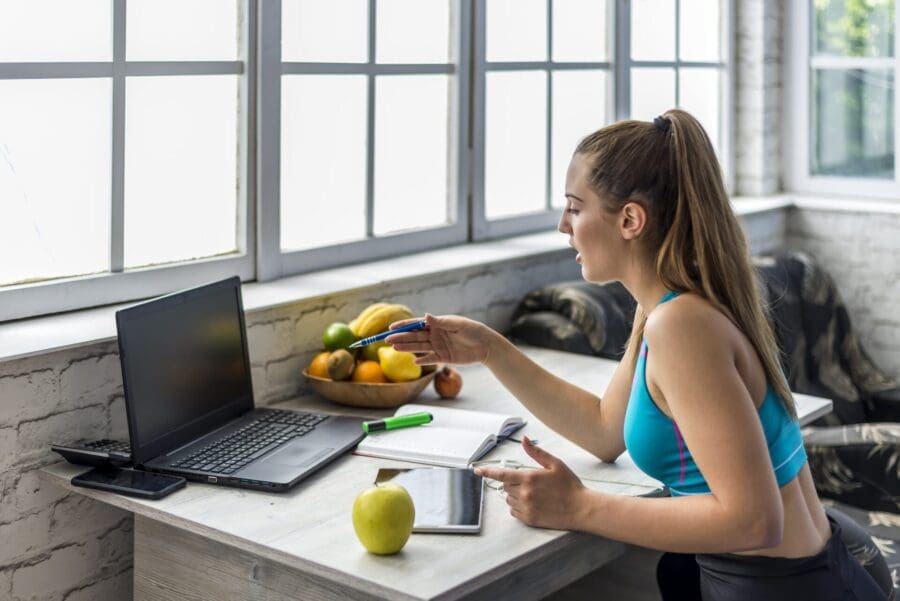 nutritionist salary uk women talking to laptop