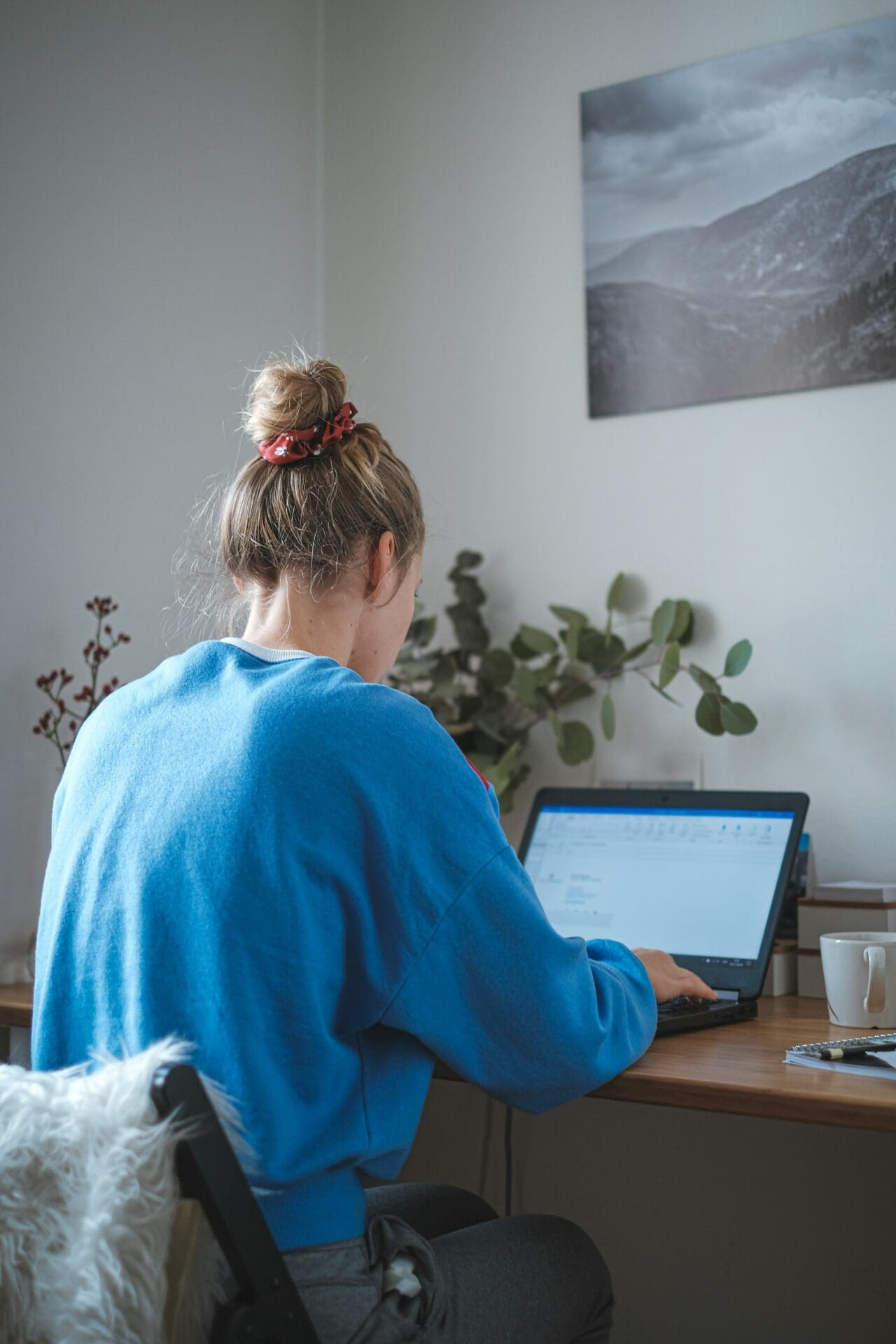 Student doing her Pilates instructor training course online.