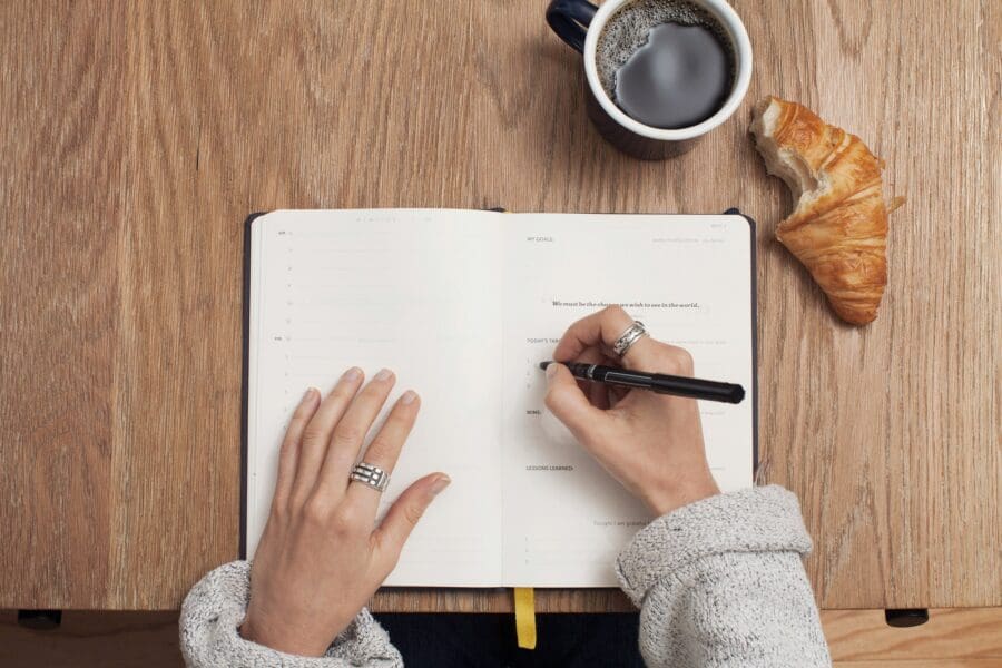 A trainer about to write down her personal training and diet plan.